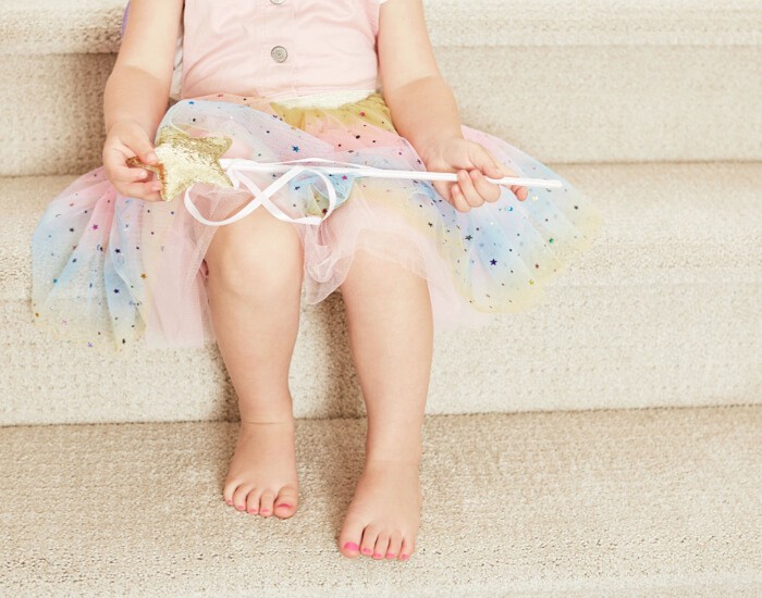 Baby sitting on carpet floor | St.Francis Flooring Inc.